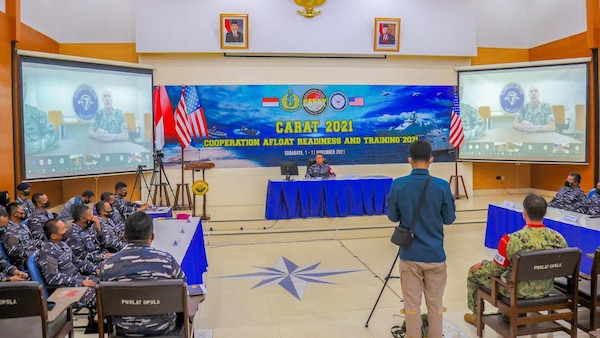 Capt. Tom Ogden, commodore of Destroyer Squadron 7, provides remarks virtually to U.S. and Indonesian military personnel during the opening ceremony for Cooperation Afloat and Readiness at Sea Training (CARAT) Indonesia 2021. In its 27th year, the CARAT series is comprised of multinational exercises, designed to enhance U.S. and partner navies’ abilities to operate together in response to traditional and non-traditional maritime security challenges in the Indo-Pacific region.