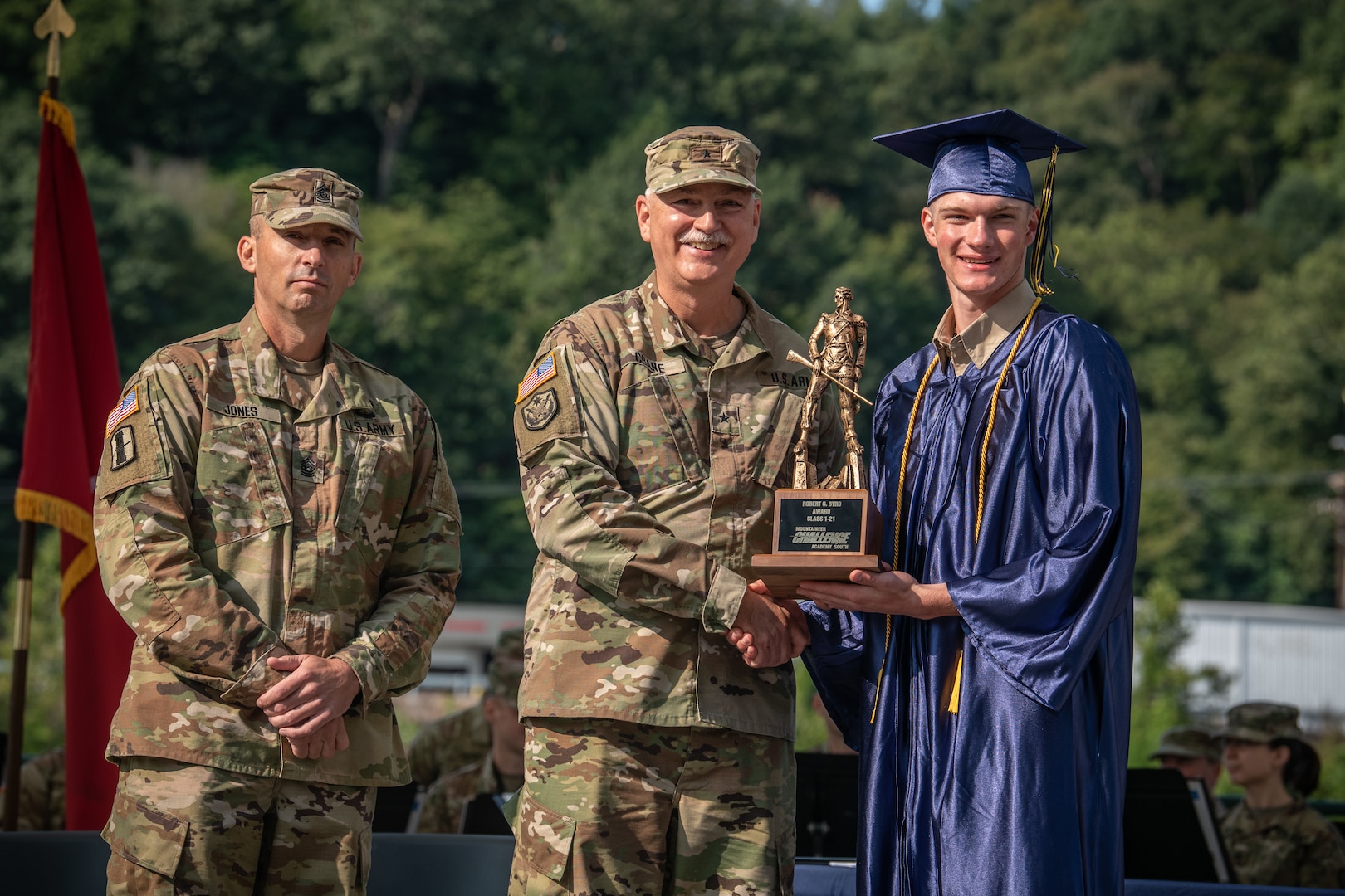 Cadet William Farkas receives the Robert C. Byrd Award from Brig. Gen. William "Bill" Crane, Adjutant General of the West Virginia National Guard, during graduation at the Mountaineer Challenge Academy in Charleston, W.Va., September 10, 2021. Farkas is hoping to use his time at MCA to further his pursuit of an appointment to West Point. (U.S. Army National Guard Photo by Edwin Wriston)