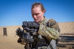 U.S. Army Spc. Emma E. Archut, 328th Military Police Company, dons her M50 gas mask during the stress shoot portion of the New Jersey Army National Guard’s Best Warrior Competition at Joint Base McGuire-Dix-Lakehurst, N.J., April 10, 2019. During this part of the competition, the five Soldiers, one Airman, and three NCOs will evaluated on high and low crawl, sled drag, medical evaluation, 9-line medical evacuation request, M249 machine gun breakdown, and an M9 pistol and M4 carbine tactical shoot. The Competition runs from April 8-11, 2019, with the top Soldier and NCO competing in the Region 1 Competition against National Guard Troops from the six New England states and New York. The Best Warrior Competition is an annual event, which tests their military skills and knowledge, as well as their physical fitness and endurance. (New Jersey National Guard photo by Mark C. Olsen)
