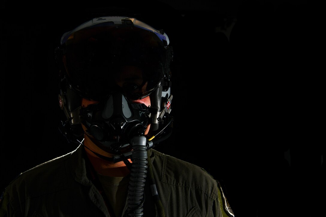 Lt. Col. Michael 'Shot' Glass shows the location of SPYDR in his helmet Oct. 28, 2021, at Barnes Air National Guard Base, Massachusetts. The SPYDR system provides an audible warning when a pilot's oxygen saturation drops below a specific threshold, enhancing their safety and tactical capabilities.(U.S. Air National Guard photo by Randy Burlingame)