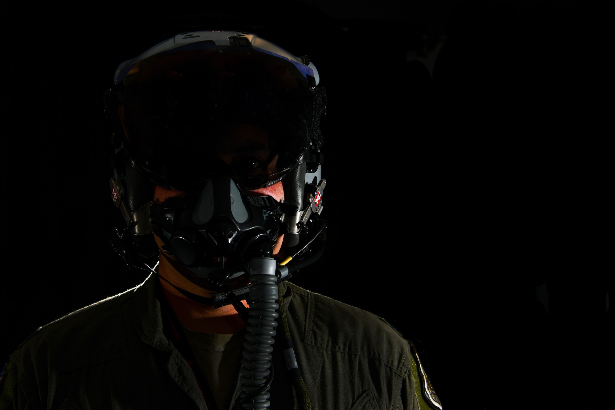 Lt. Col. Michael 'Shot' Glass shows the location of SPYDR in his helmet Oct. 28, 2021, at Barnes Air National Guard Base, Massachusetts. The SPYDR system provides an audible warning when a pilot's oxygen saturation drops below a specific threshold, enhancing their safety and tactical capabilities.(U.S. Air National Guard photo by Randy Burlingame)