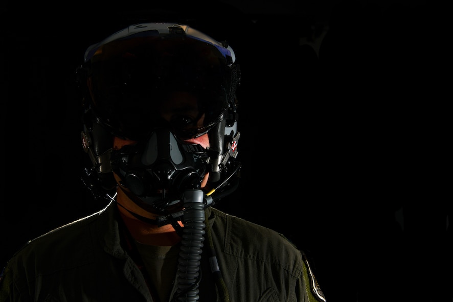 Lt. Col. Michael 'Shot' Glass shows the location of SPYDR in his helmet Oct. 28, 2021, at Barnes Air National Guard Base, Massachusetts. The SPYDR system provides an audible warning when a pilot's oxygen saturation drops below a specific threshold, enhancing their safety and tactical capabilities.(U.S. Air National Guard photo by Randy Burlingame)