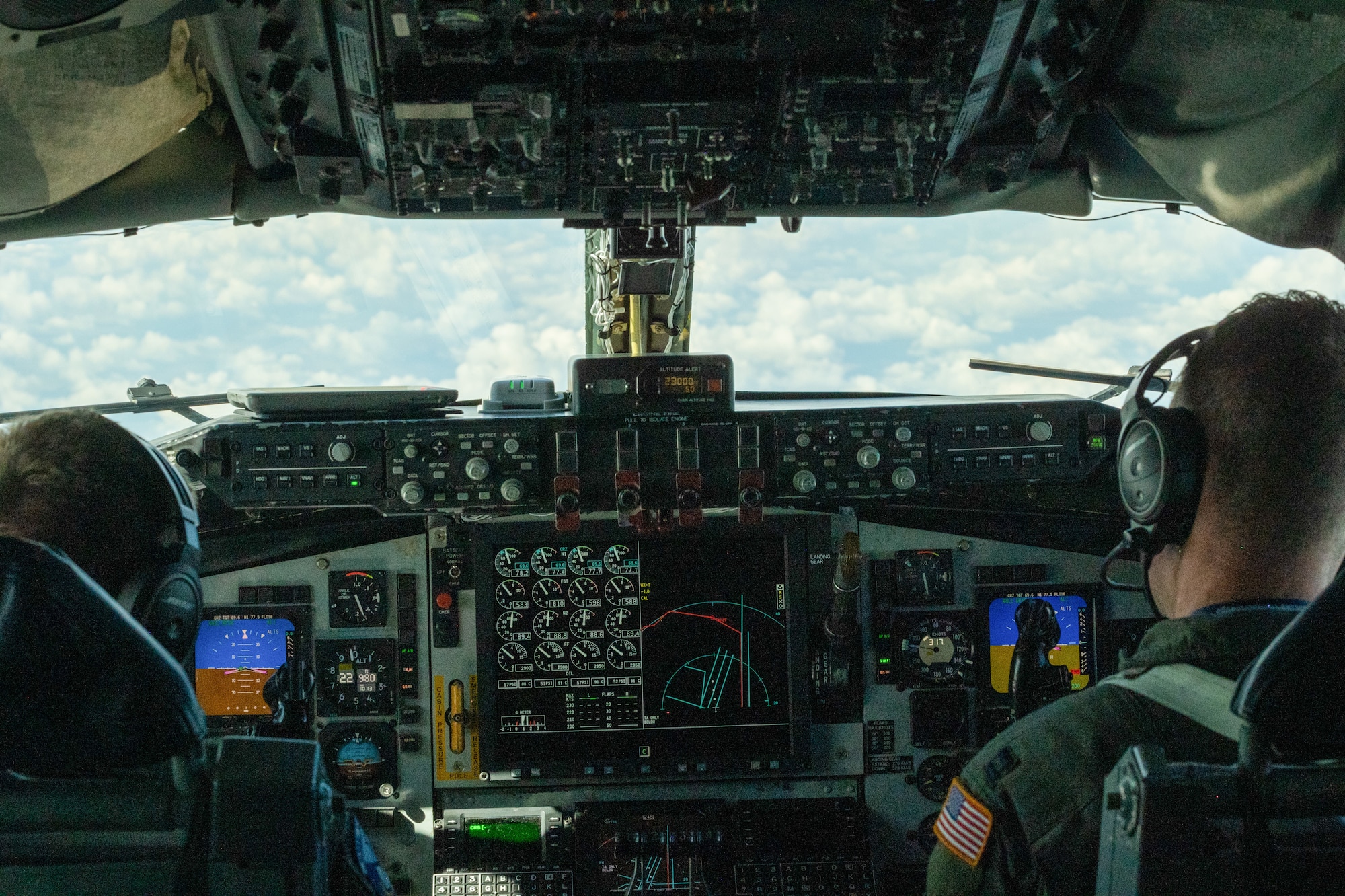 U.S. Air Force Maj. Jay Heide, left, and Capt. Nate Armes, 906th Air Refueling Squadron, pilot a KC-135 Stratotanker over the Republic of Poland during the 126th Air Refueling Wing's, Illinois Air National Guard, Aviation Detachment Rotation 21-3, in Powidz, Republic of Poland on Aug. 11, 2021.