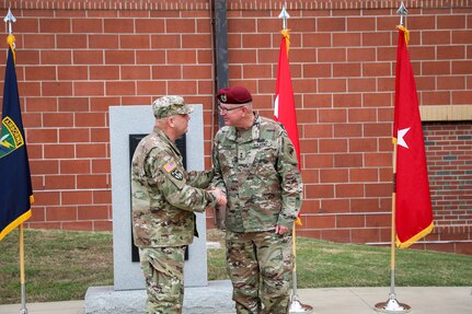 Maj. Gen. John F. Hussey, commanding general, 200th Military Police Command, congratulates Maj. Gen. Jeffrey C. Coggin, commanding general, U.S. Army Civil Affairs and Psychological Operations Command (Airborne), during the latter’s promotion ceremony, Oct. 25, 2021, Fort Bragg, N.C.