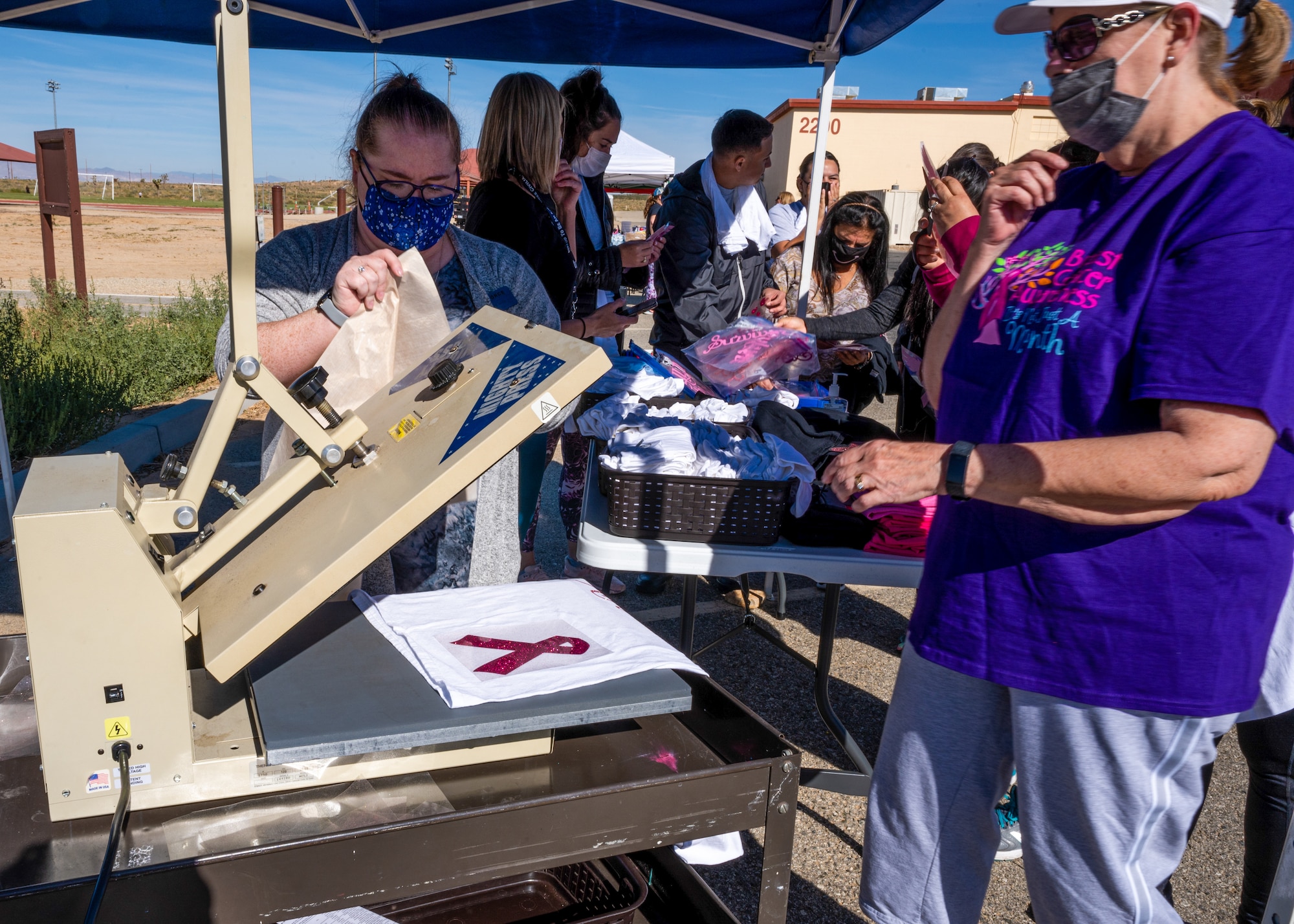 Airmen and civilians came out to the 5K Run/Walk and Mini Health Fair in support of Breast Cancer Awareness Month at the Rosburg Fitness Center on Edwards Air Force Base, California, Oct. 20. The first 50 participants received free T-shirts with the ubiquitous pink ribbon symbol for breast cancer. (Air Force photo by Katherine Franco)