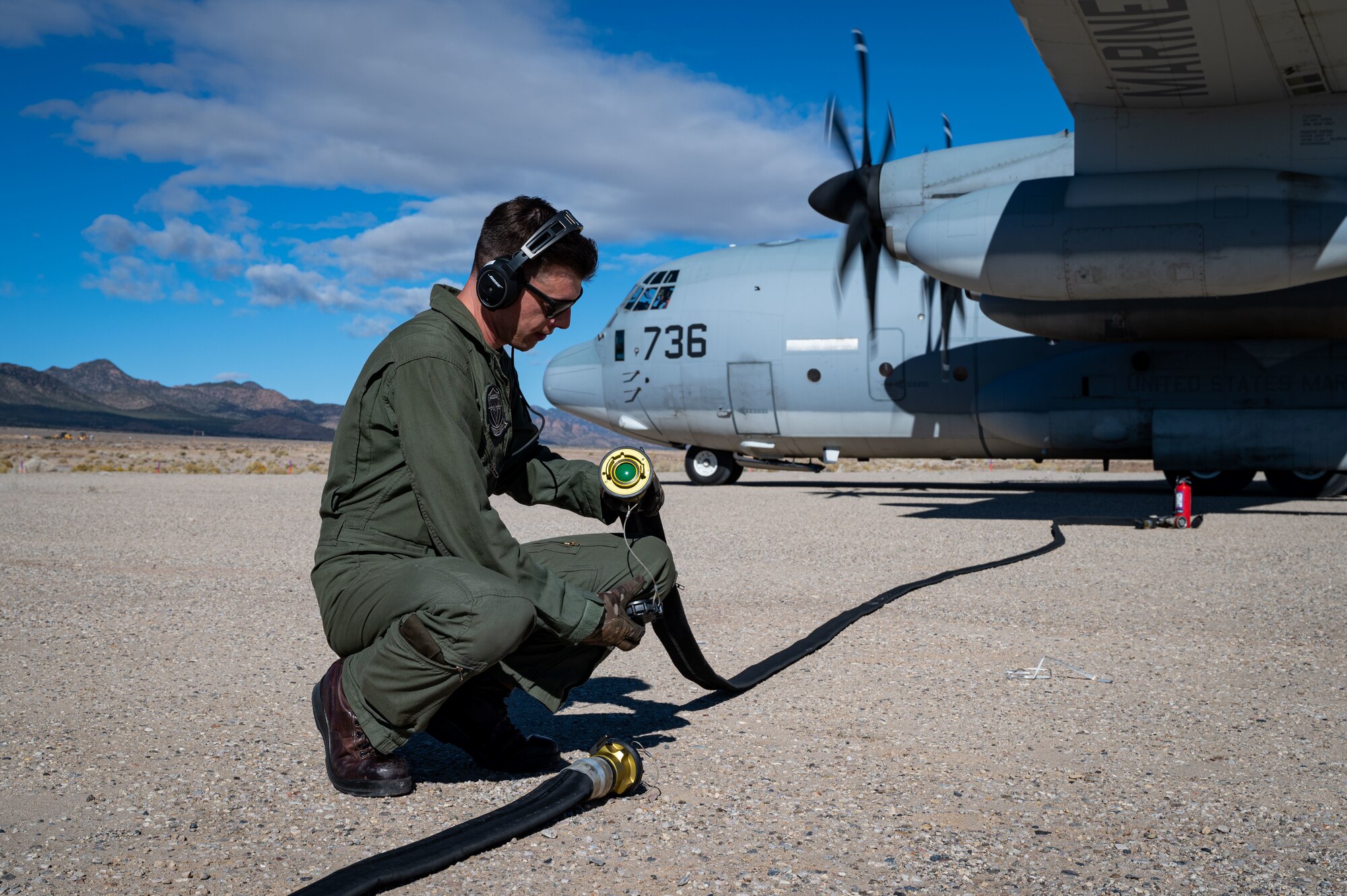 Staff Sgt. Justin Triplett, Marine Aerial Refueler Transport Squadron 352 (VMGR-352), Marine Aircraft Group 11, 3rd Marine Aircraft Wing KC-130J Super Hercules tanker loadmaster, participates in a simulated search and rescue exercise on the Nevada Test and Training Range, Oct. 27, 2021