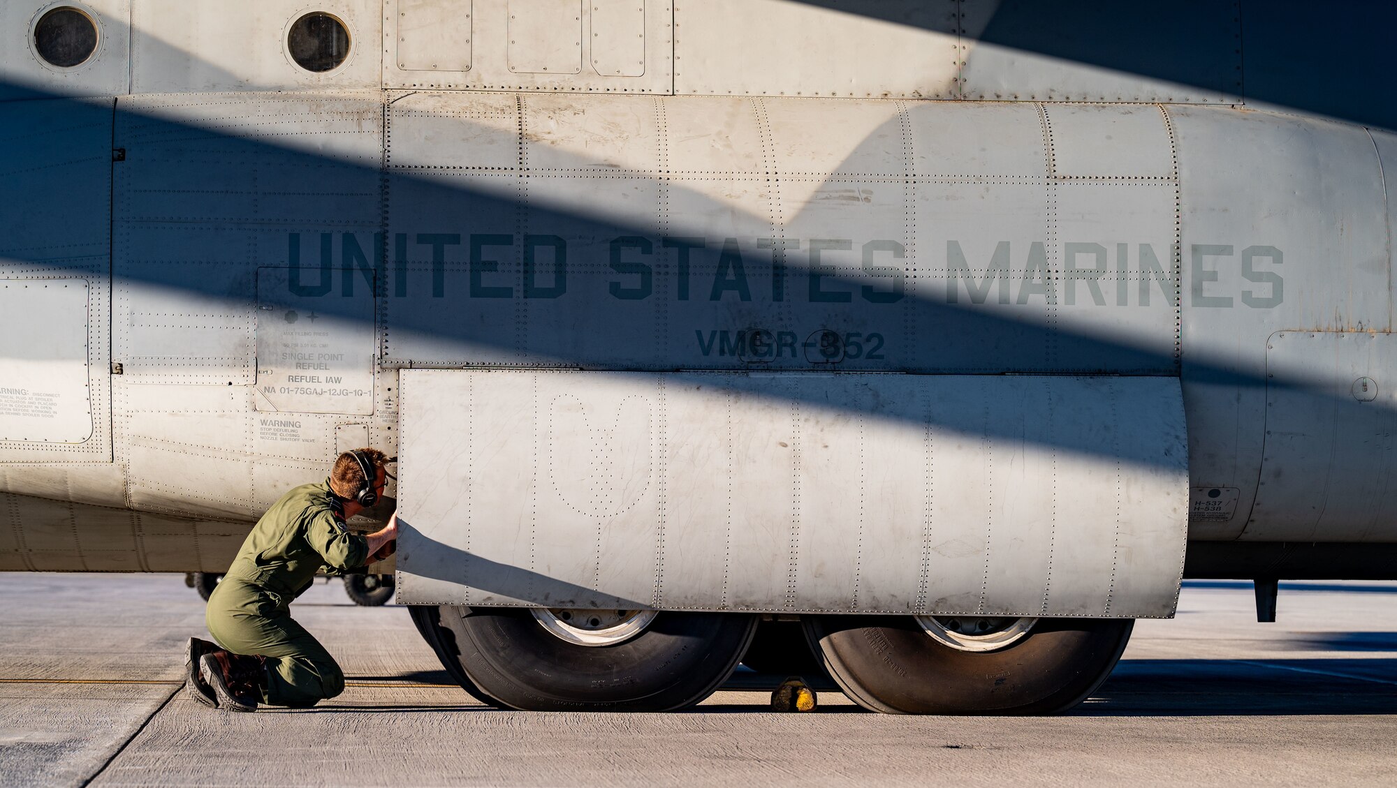 Flight Lt. Dan Stanley, Marine Aerial Refueler Transport Squadron 352 (VMGR-352), Marine Aircraft Group 11, 3rd Marine Aircraft Wing KC-130J Super Hercules tanker aircraft commander, performs pre-flight inspections on the flight line at Nellis Air Force Base, Nevada, Oct. 27