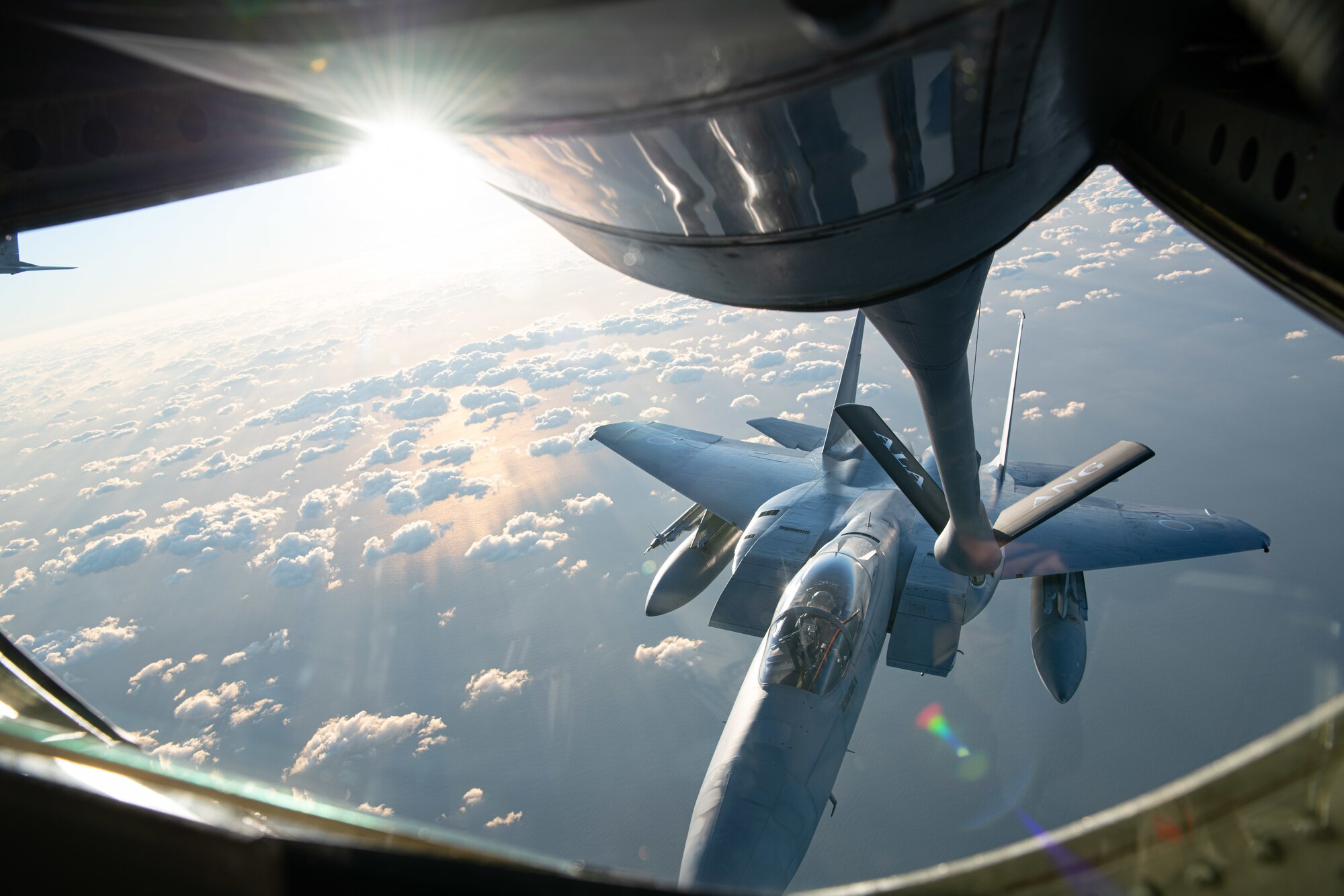 A U.S. Air Force KC-135 Stratotanker from the 909th Air Refueling Squadron refuels a Japan Air Self-Defense Force F-15J Eagle over the Pacific Ocean during Exercise Southern Beach, Oct. 28, 2021. Bilateral training exercises like Southern Beach help build trusting relationships among foreign and domestic forces, ensuring allies are able to come together to effectively respond to demanding scenarios and execute high-end missions in defense of a free and open Indo-Pacific region. (U.S. Air Force photo by Staff Sgt. Savannah L. Waters)