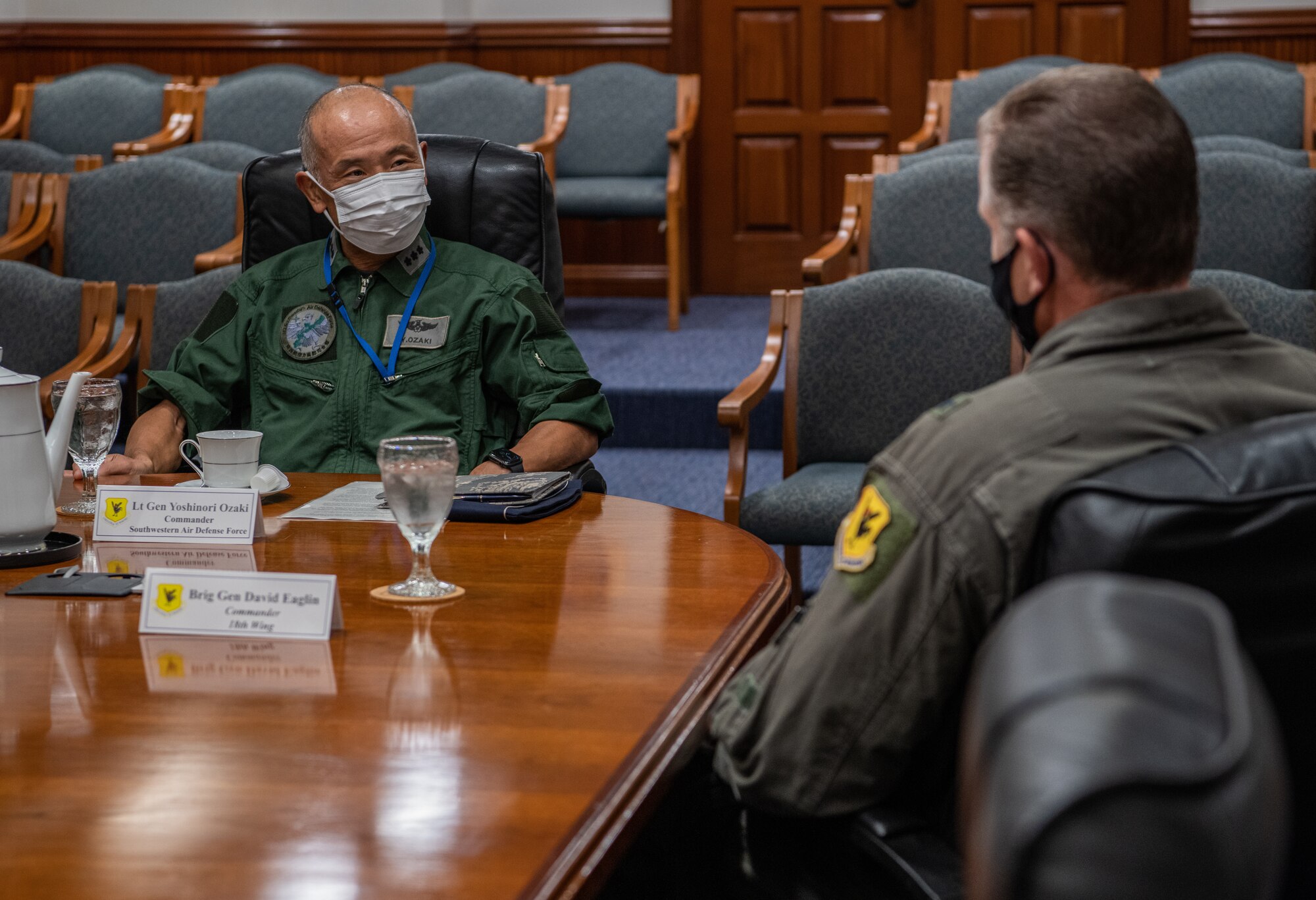 Japan Air Self-Defense Force Lt. Gen. Yoshinori Ozaki, left, Southwestern Defense Force commander, meets with U.S. Air Force Brig. Gen. David Eaglin, right, 18th Wing commander, at Kadena Air Base, Japan, Oct. 29, 2021. Leaders from both forces met during Exercise Southern Beach, an exercise that allows both forces the opportunity to practice mission planning, flying and debriefing each other. (U.S. Air Force photo by Airman 1st Class Anna Nolte)