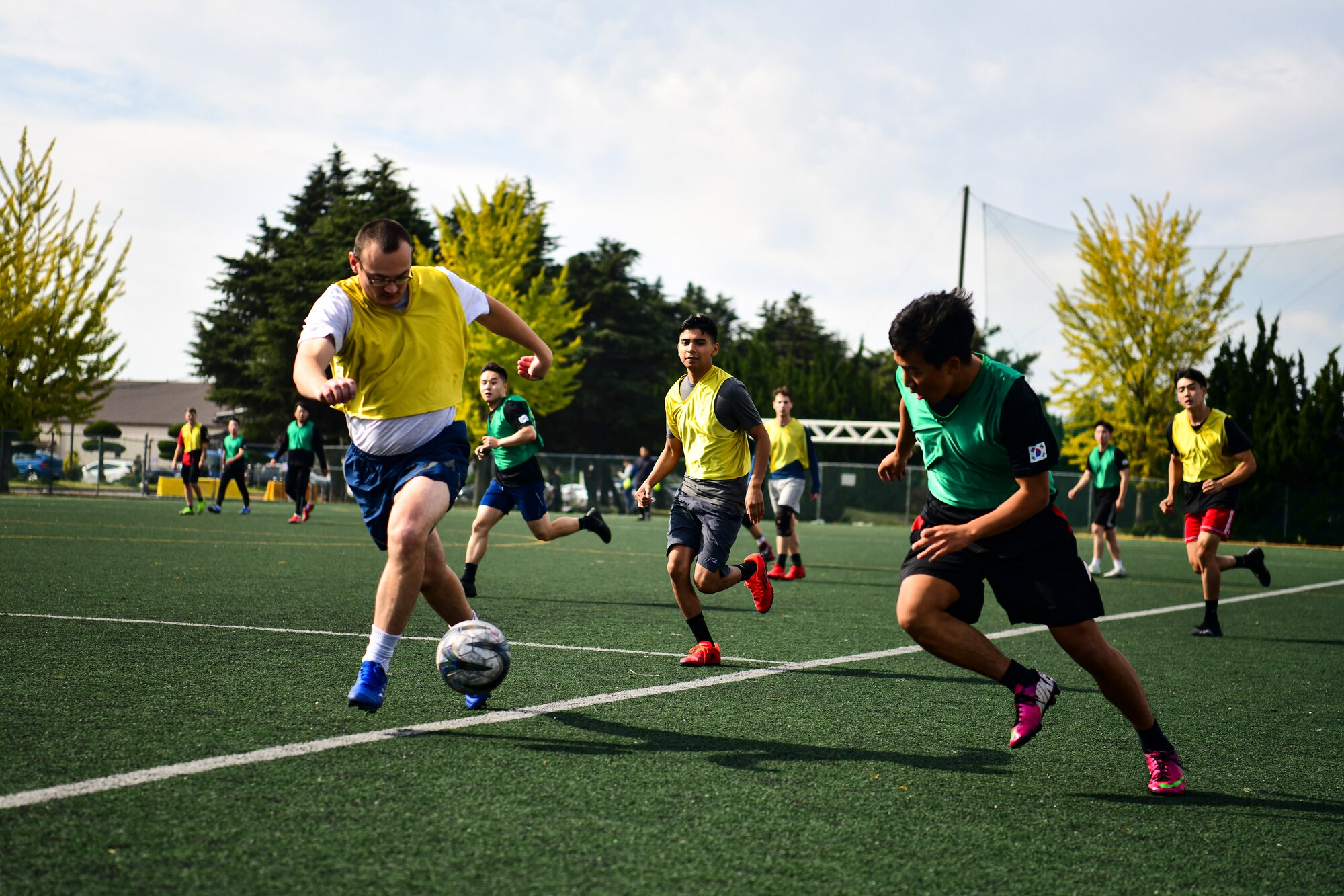 Airmen playing soccer.