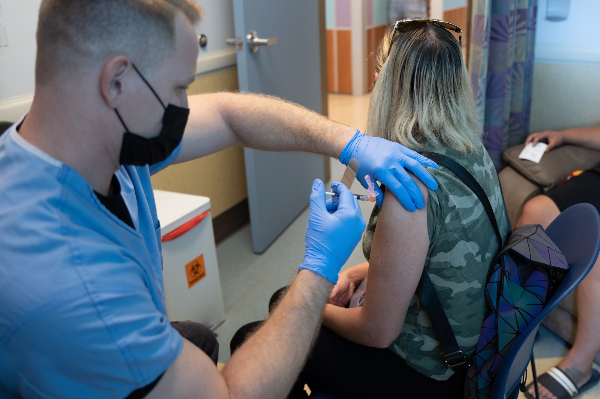 Spc. Jordan T. Clapson, a medical specialist from the Task Force Medical, Hawaii National Guard Joint Task Force administered a dose of the Pfizer-BioNtech vaccine to an Oʻahu resident at the Waianae Coast Comprehensive Health Center in Waianae, Hawaii on October 28, 2021. Army and Air National Guard medical personnel continue to support the State Department of Health at multiple sites statewide with administering COVID-19 vaccines to eligible recipients.