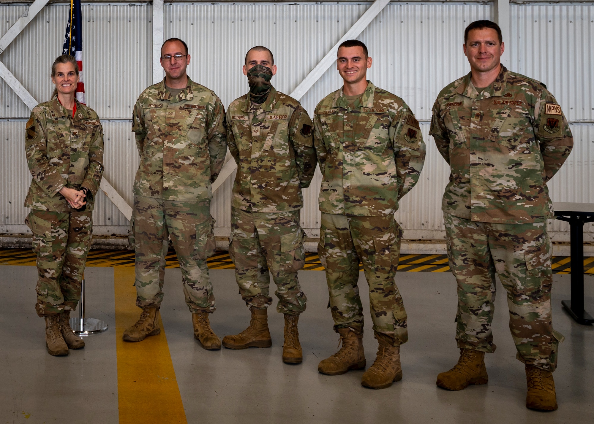 Col. Leah Fry, left, 4th Maintenance Group commander and Chief Richard Northrup, right, 4th MXG wing weapons manager, recognize the winning bomb build crew of the quarter, the 4th Munitions Squadron who represented the 334th Fighter Generation Squadron at Seymour Johnson Air Force Base, North Carolina, Oct. 21, 2021.