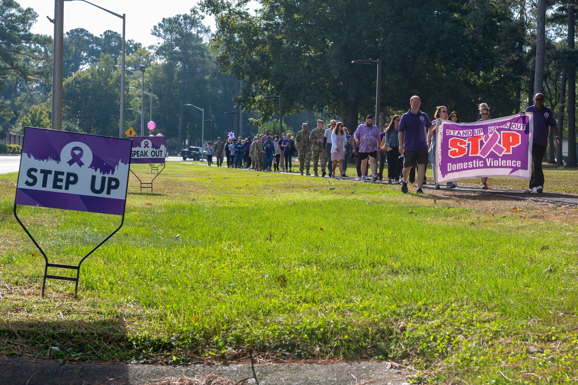 Members of Team Seymour participate in Walk in my Shoes to raise domestic violence awareness at Seymour Johnson Air Force Base, North Carolina, Oct. 21, 2021.