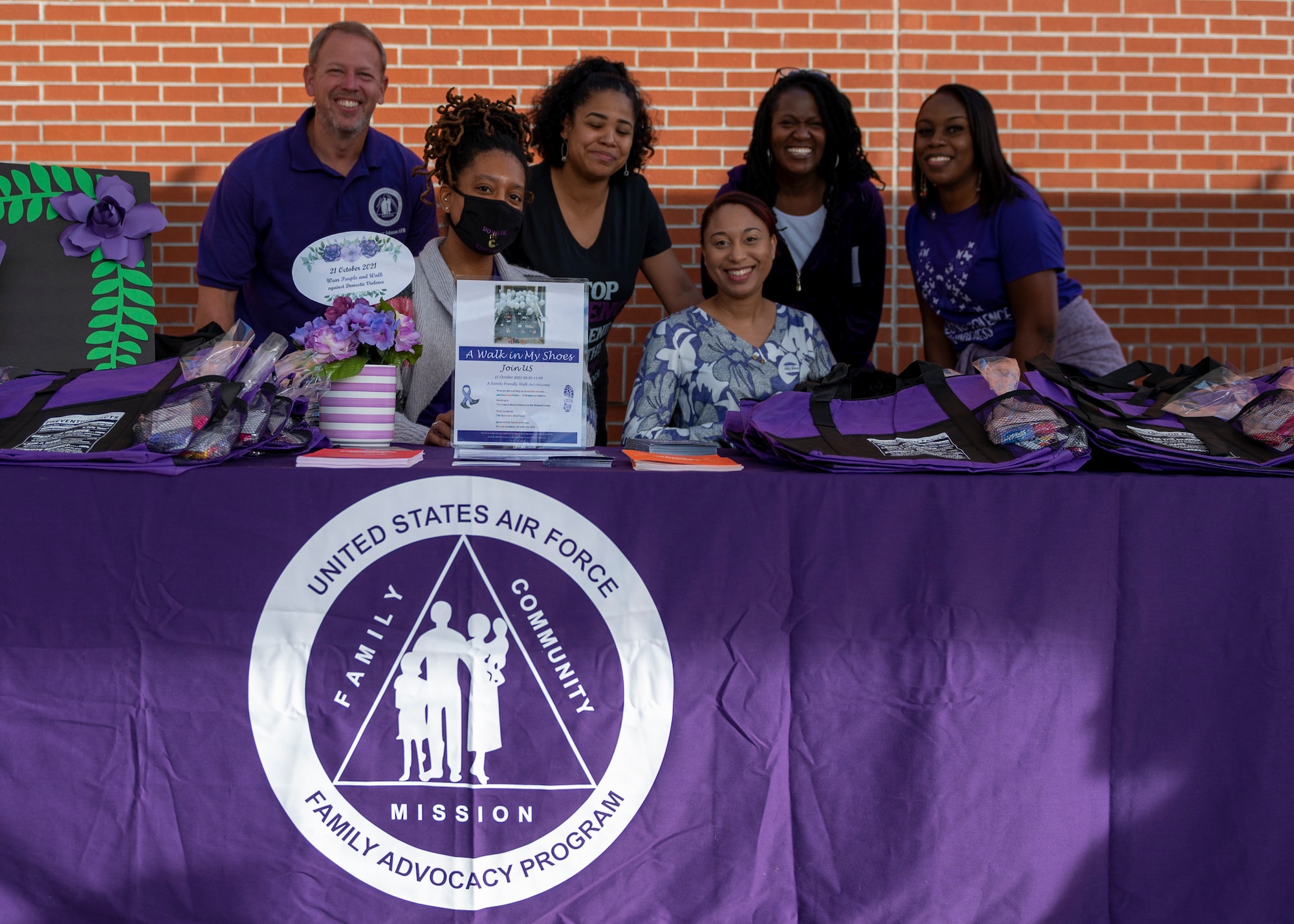Family Advocacy Program members setup an information booth at Seymour Johnson Air Force Base, North Carolina, Oct. 21, 2021.