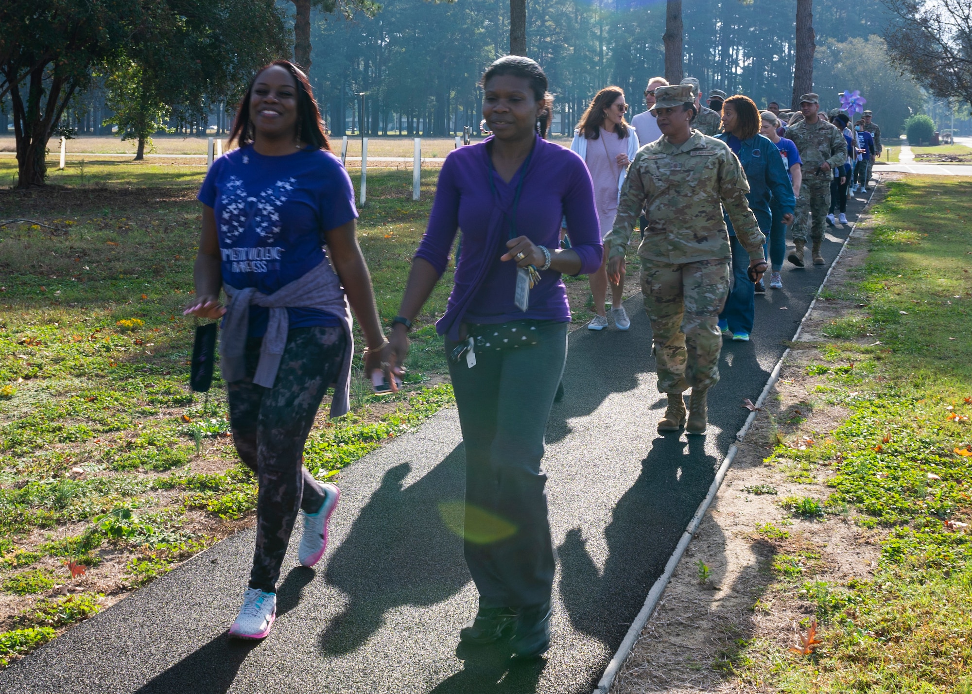 Members of Team Seymour participate in Walk in my Shoes to raise domestic violence awareness at Seymour Johnson Air Force Base, North Carolina, Oct. 21, 2021.