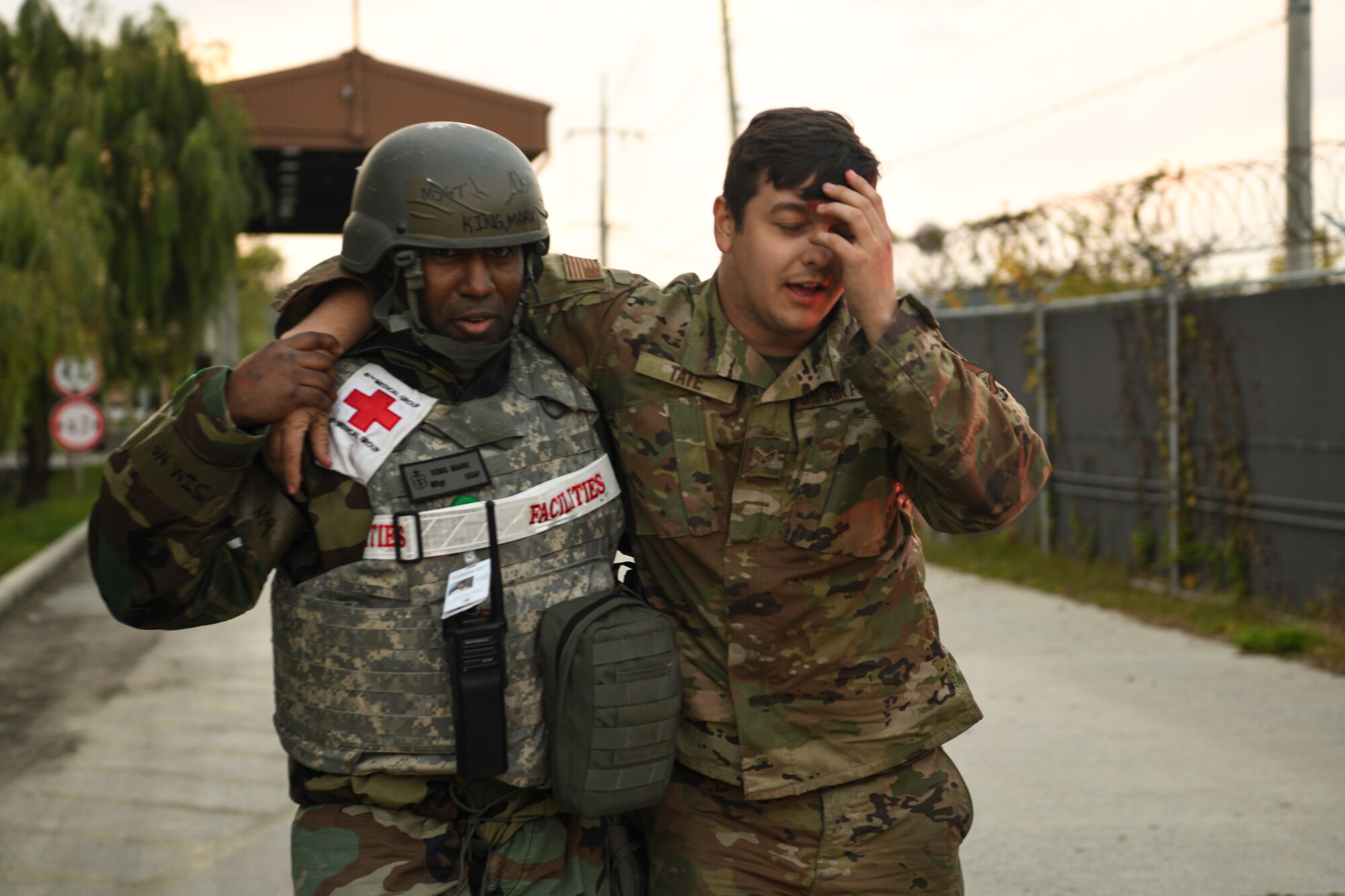 Master Sgt. Mark King, 8th Medical Group medical technician, guides Senior Airman Joshua Tate, 8th Logistics Readiness Squadron vehicle maintenance technician, to safety during routine training at Kunsan Air Base, Republic of Korea, Nov. 1, 2021. The 8th Medical Group supports the 8th Fighter Wing, Kunsan AB, and comprises the 8th Healthcare Operations Squadron (HCOS) and 8th Operational Medical Readiness Squadron (OMRS). This support is executed by delivering preventive health services and outpatient medical care to over 2,800 base personnel. (U.S. Air Force photo by Staff Sgt. Jesenia Landaverde)
