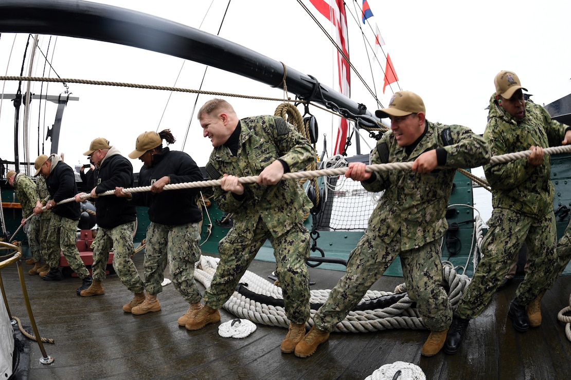 Chief petty officer (CPO) selectees conduct line handling operations during CPO Heritage Week on board the USS Constitution.