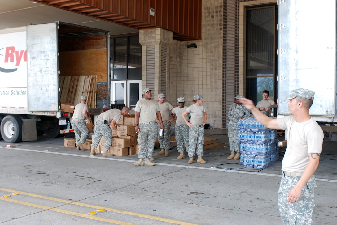 National guardsmen unload a trick