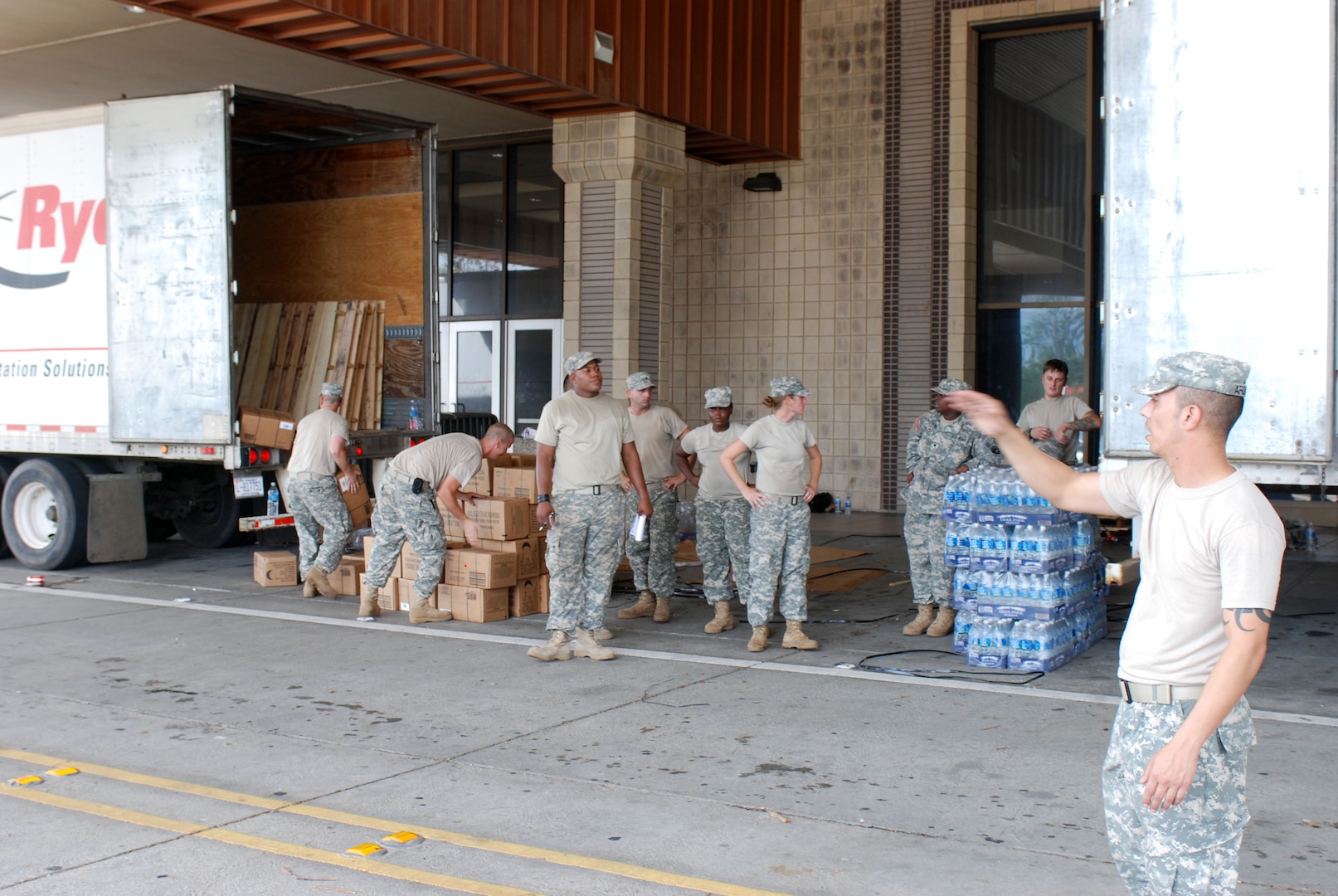 National guardsmen unload a trick