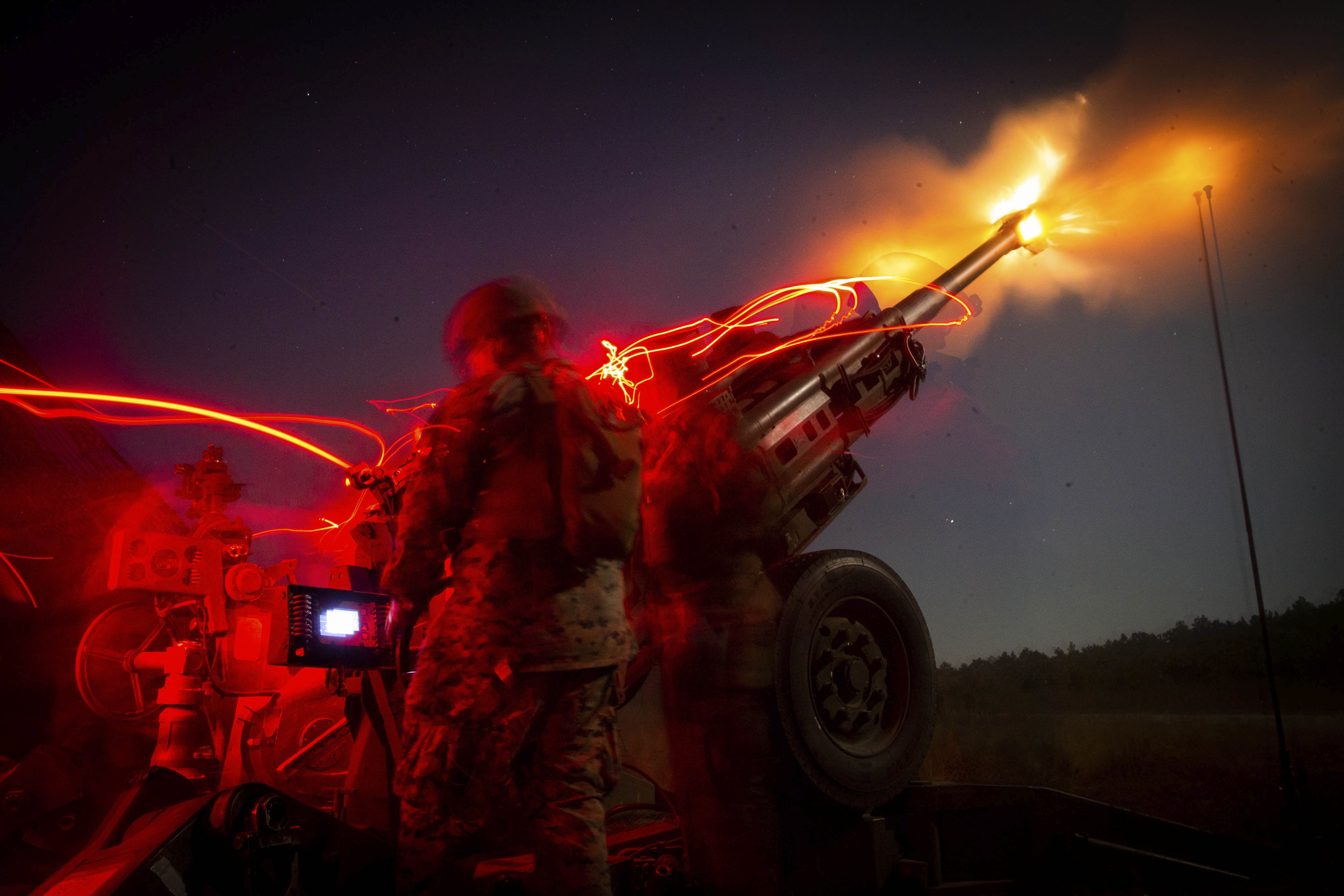A Marine firing a M777