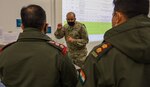 Maj. Sameer Puri, Washington National Guard, briefs Col. Yash Patel and Col. Mudit Mahajan of the Indian Army about cyber support in Yudh Abhyas Command Post Exercise at Joint Base Elmendorf-Richardson, Alaska, Oct. 20, 2021. Yudh Abhyas is an annual bilateral training exercise to improve the interoperability of the Indian and U.S. Army.