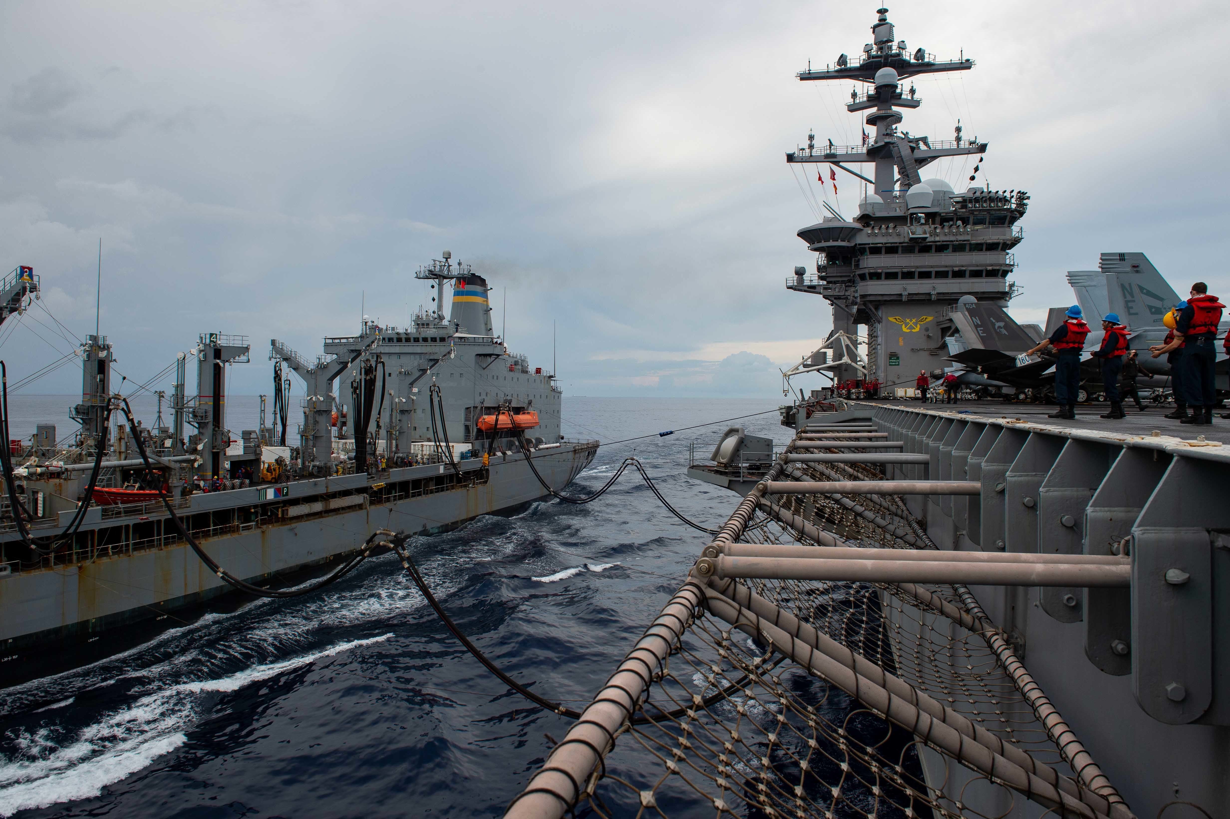 The Nimitz-class aircraft carrier USS Carl Vinson (CVN 70) conducts a replenishment-at-sea with Henry J. Kaiser-class fleet replenishment ship USNS Tippecanoe (T-AO 199), Nov. 1, 2021.