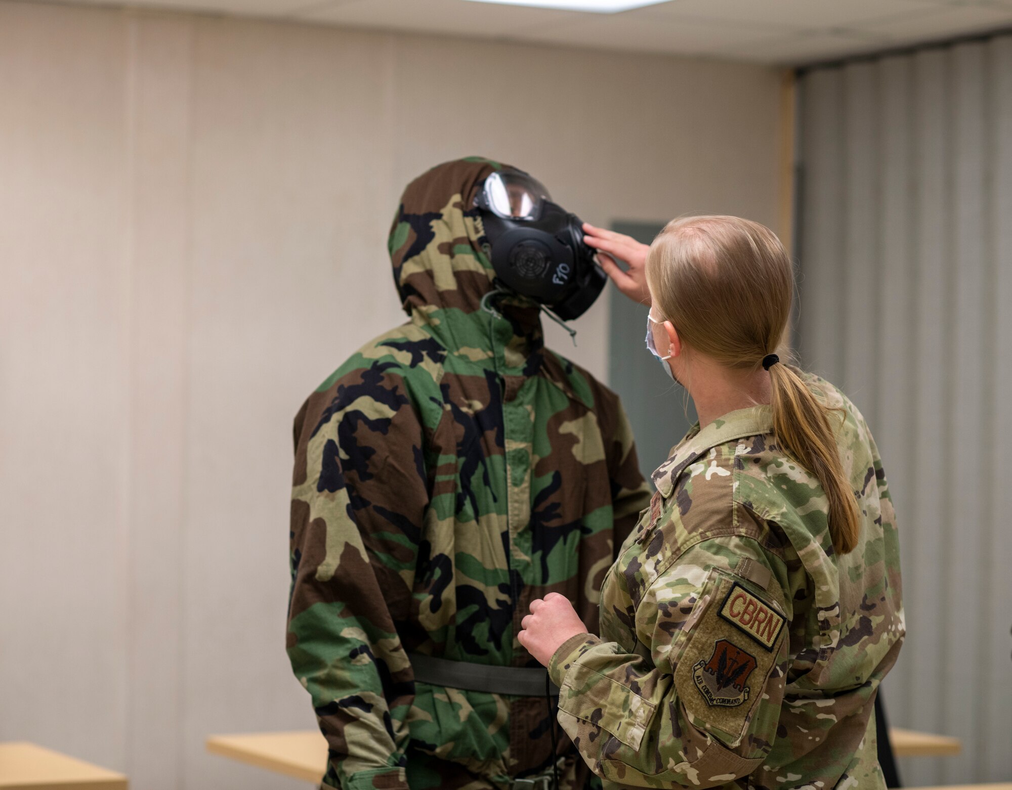 Woman checks gasmask