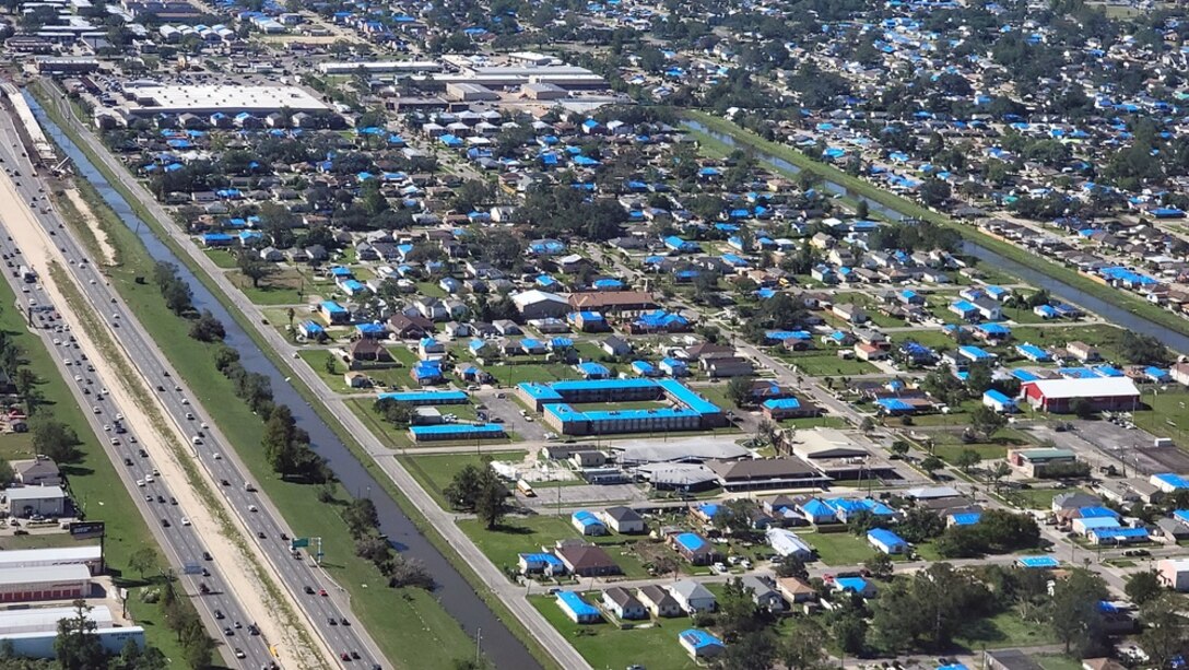 Aerial view of blue roofs at Kenner, Louisiana. The U.S. Army Corps of Engineers, has been tasked by FEMA to assist eligible homeowners with temporary roof repairs through the Operation Blue Roof program. More than 30,000 temporary Blue Roofs have been installed with contractors averaging more than 1000 roof installs per day, weather permitting.