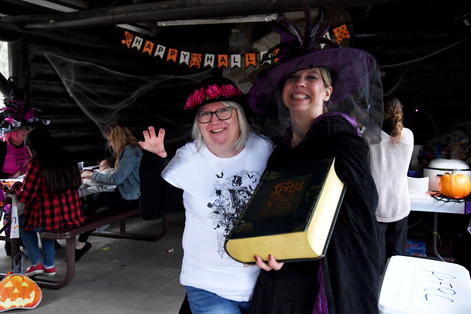 Jackie Pope, 81st Force Support Squadron Airmen and Family Readiness Chief, and Holly Fisher, 81st FSS worklife specialist, pose for a photo during Ghouls in the Park at the marina park on Keesler Air Force Base, Mississippi, Oct. 29, 2021. The Halloween event also featured a haunted house, a boo bus and various games for children of all ages. (U.S. Air Force photo by Kemberly Groue)