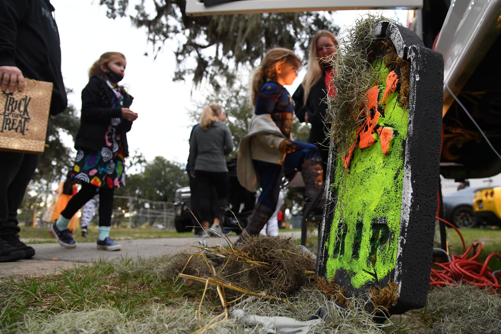 Keesler families board the boo bus during Ghouls in the Park at the marina park on Keesler Air Force Base, Mississippi, Oct. 29, 2021. The Halloween event also featured a haunted house, trunk-or-treat and various games for children of all ages. (U.S. Air Force photo by Kemberly Groue)