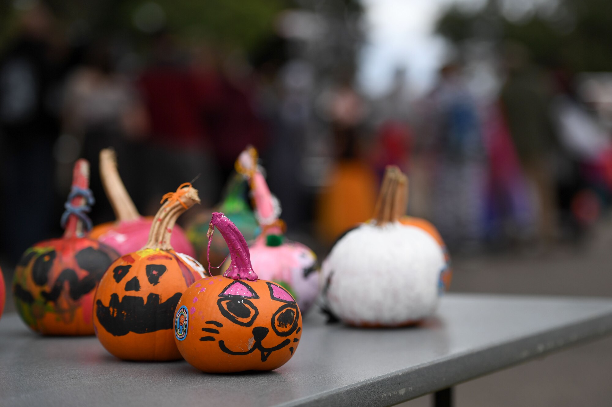 Painted pumpkins are on display during Ghouls in the Park at the marina park on Keesler Air Force Base, Mississippi, Oct. 29, 2021. The Halloween event also featured a haunted house, trunk-or-treat and various games for children of all ages. (U.S. Air Force photo by Kemberly Groue)