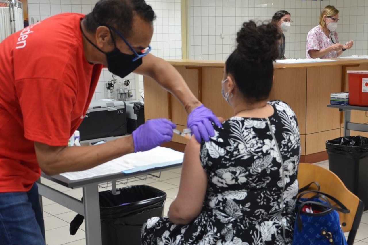 A woman receives a COVID-19 vaccination.