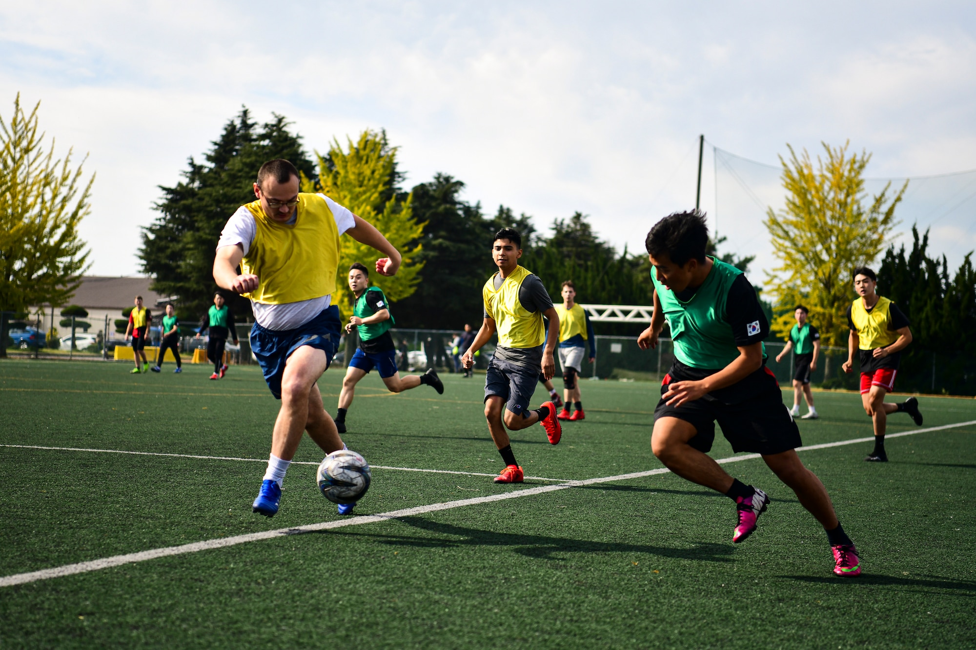 Airmen playing soccer.