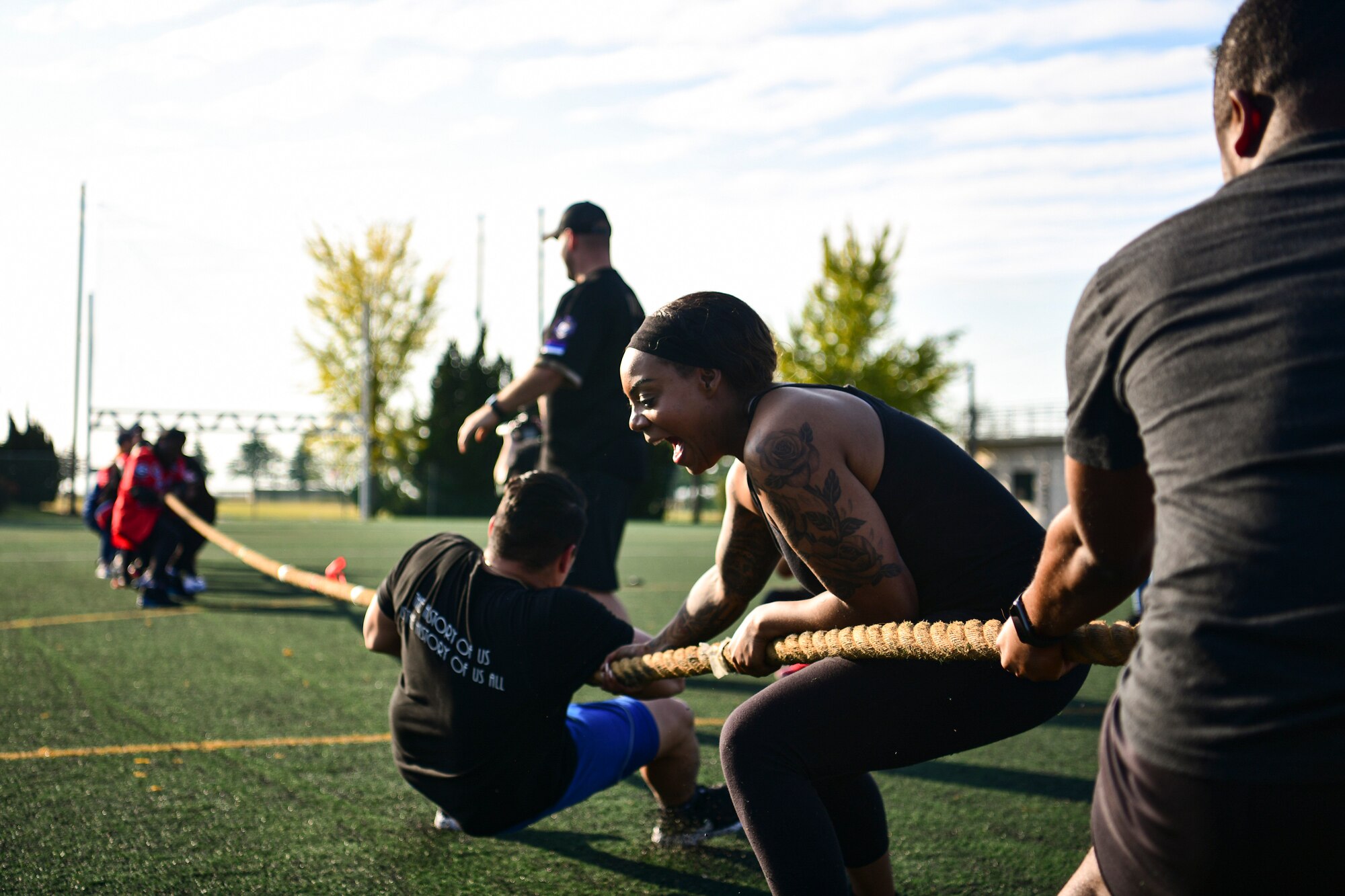 Tug-of-war competition with airman yelling.