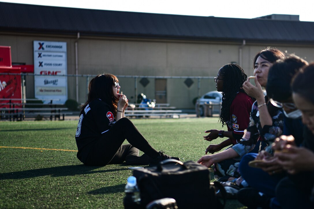 Airmen playing a Korean kids game.