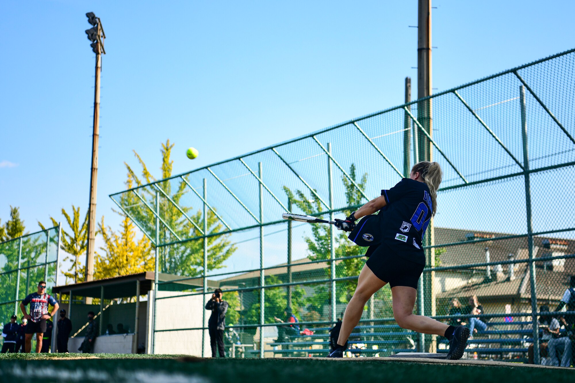 A U.S. Airman playing softball.