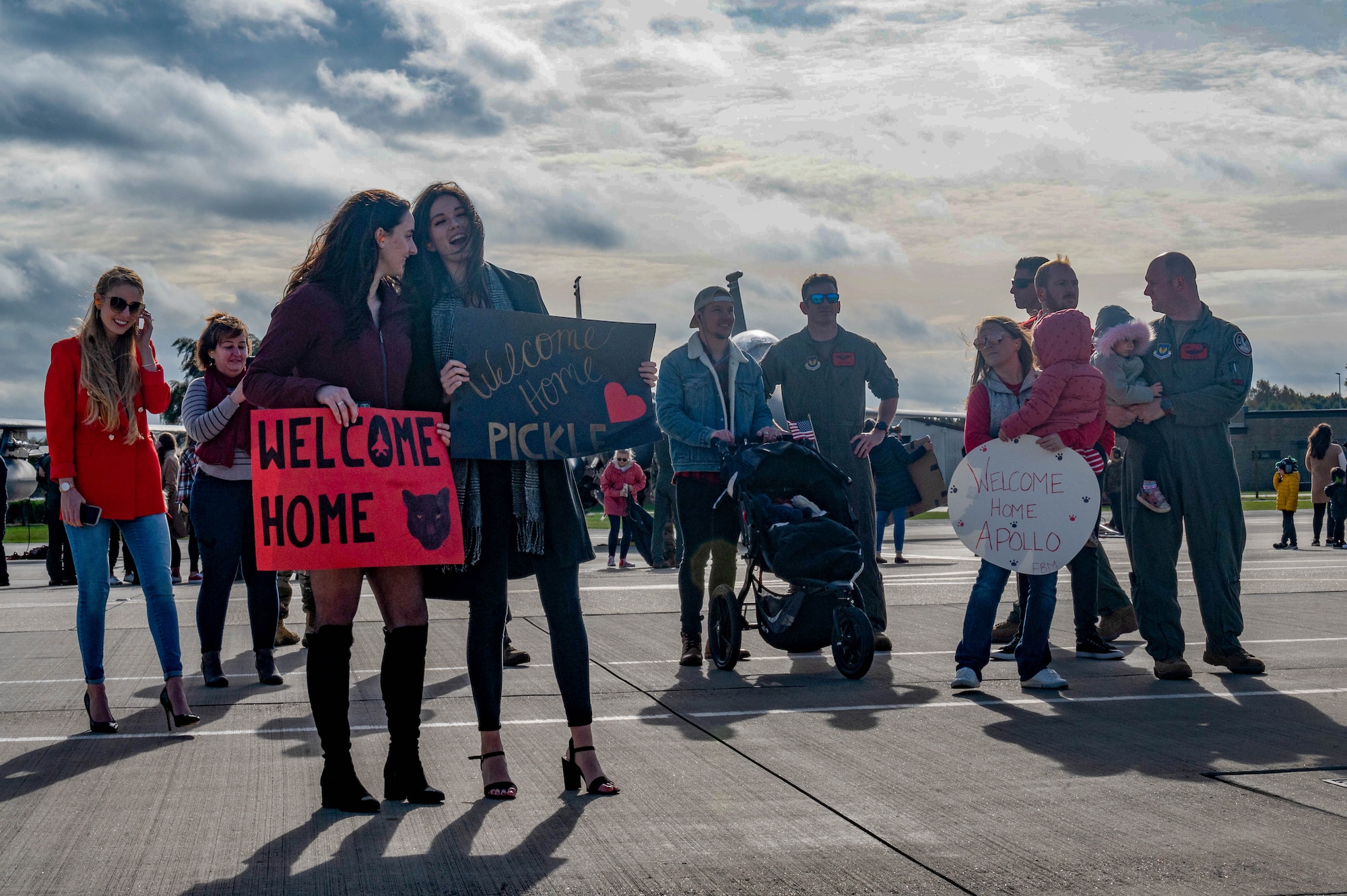 Family and friends await the return of the 494th Fighter Squadron personnel from their recent deployment at Royal Air Force Lakenheath, England, Oct. 26, 2021. While conducting operations in support of Operation Inherent Resolve, the Panthers simultaneously flew their F-15E Strike Eagles in support of Operation Final Countdown and Operation Allies Welcome. (U.S. Air Force photo by Airman 1st Class Jacob Wood)