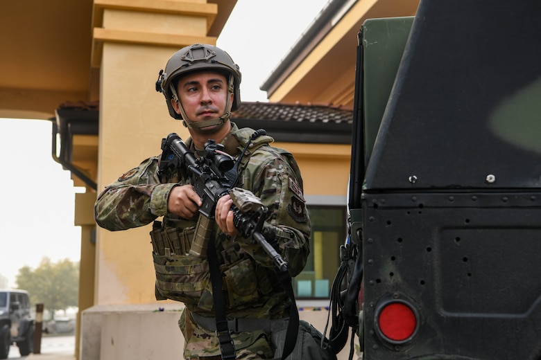 An Airman assigned to the 31st Security Forces Squadron readies his weapon during a base defense exercise at Aviano Air Base, Italy, Nov. 2, 2021. The exercise was designed to test the 31st Fighter Wing’s ability to respond to a variety of potential threats, protect and generate combat airpower, and defend the base. (U.S. Air Force photo by Senior Airman Elijah M. Dority)
