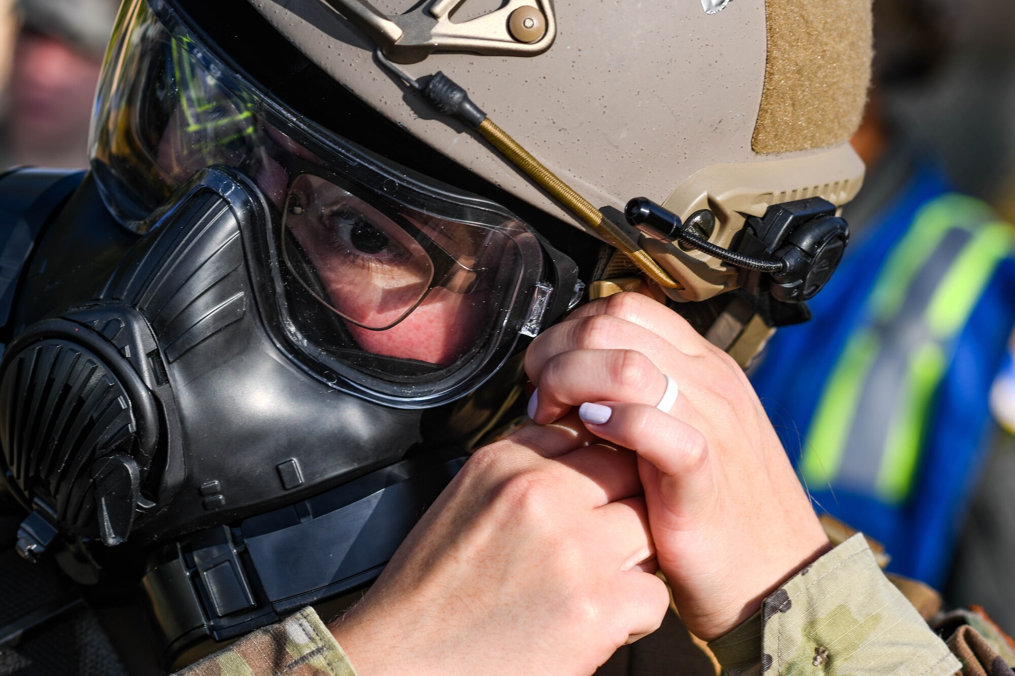 An Airman assigned to the 31st Medical Group secures her gas mask during a base defense exercise at Aviano Air Base, Italy, Nov. 2, 2021. The exercise was designed to increase overall readiness of Airmen to respond to a variety of threats in a degraded or contaminated environment to safeguard and execute the 31st Fighter Wing’s mission. (U.S. Air Force photo by Senior Airman Elijah M. Dority)