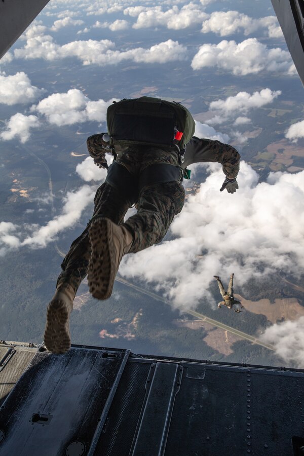 U.S. Marines with 3d Force Reconnaissance Company, 4th Recon Battalion, jump from a CH-53E Super Stallion with Marine Heavy Helicopter Squadron 772, Marine Aircraft Group 49, Marine Forces Reserve, while conducting military free-fall training over Mississippi during exercise Raven 22-2, Oct. 25, 2021. Exercise Raven facilitated joint training with active and reserve component Marines, enabling a more capable and ready reserve force. (U.S. Marine Corps photo by Cpl. Brendan Mullin)