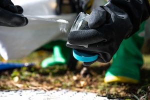 An Airman assigned to the 31st Medical Group takes a sample of a simulated hazardous chemical during a base defense exercise at Aviano Air Base, Italy, Nov. 2, 2021. The exercise was designed to test the 31st Fighter Wing’s ability to operate in different levels of defensive postures, respond to emerging threats including Chemical, Biological, Radiological, Nuclear and Explosives, protect and generate combat airpower, and defend the base. (U.S. Air Force photo by Senior Airman Elijah M. Dority)