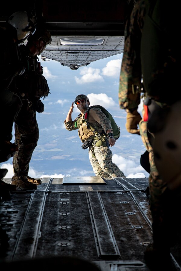 U.S. Marine Corps Staff Sgt. Andrew Rodriguez, a reconnaissance Marine with 3d Force Reconnaissance Company, 4th Recon Battalion, jumps from a CH-53E Super Stallion with Marine Heavy Helicopter Squadron 772, Marine Aircraft Group 49, Marine Forces Reserve, while conducting military free-fall training over Mississippi during exercise Raven 22-2, Oct. 25, 2021. HMH-772 supported exercise Raven 22-2 by providing a platform to conduct aerial raids, casualty evacuations, and military free-fall training. (U.S. Marine Corps photo by Cpl. Brendan Mullin)