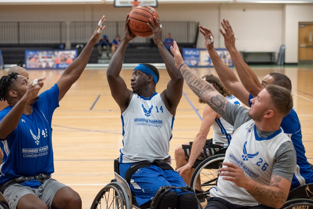 Air Force athletes practice wheelchair basketball.
