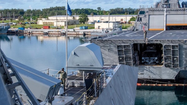 USS Charleston and USS Tulsa Sailors Observe Morning Colors