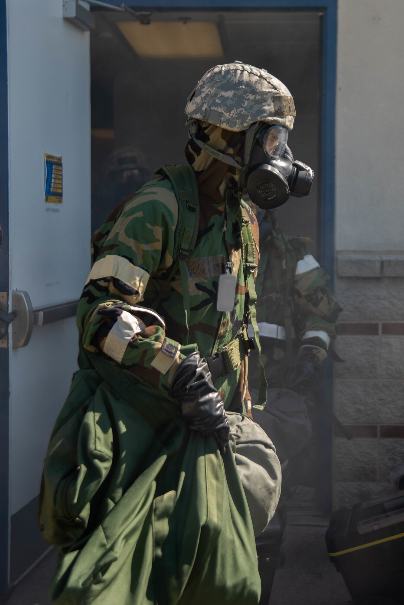 Airman in exercise gear exits building