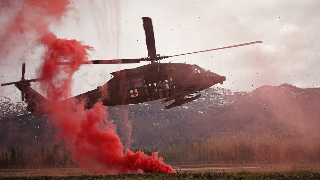 An Alaska Army National Guard UH-60L Black Hawk helicopter assigned to the 1st Battalion, 207th Aviation Regiment, approaches Bryant Army Airfield while supporting a full mission profile exercise conducted by the 212th RQS at Joint Base Elmendorf-Richardson, Alaska, Oct. 13, 2021. The busiest rescue force in the Department of Defense, the 212th RS provides elite pararescuemen and combat rescue officers that are uniquely skilled in integrating air and ground capabilities to carry out the 176th Wing’s wartime and peacetime personnel recovery missions. (U.S. Army National Guard photo by Dana Rosso)