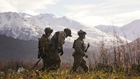 Alaska Air National Guardsmen assigned to the 212th Rescue Squadron, 176th Wing, make their way back to a staging area after loading patients on an Alaska Army National Guard UH-60L Black Hawk helicopter while conducting a full mission profile exercise at Joint Base Elmendorf-Richardson, Alaska, Oct. 13, 2021. The busiest rescue force in the Department of Defense, the 212th RQS provides elite pararescuemen and combat rescue officers that are uniquely skilled in integrating air and ground capabilities to carry out the 176th Wing’s wartime and peacetime personnel recovery missions. (U.S. Army National photo by Dana Rosso)