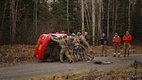 Alaska Air National Guardsmen assigned to the 212th Rescue Squadron, 176th Wing, flip a vehicle while conducting a full mission profile exercise at Joint Base Elmendorf-Richardson, Alaska, Oct. 13, 2021. The busiest rescue force in the Department of Defense, the 212th RQS provides elite pararescuemen and combat rescue officers that are uniquely skilled in integrating air and ground capabilities to carry out the 176th Wing’s wartime and peacetime personnel recovery missions. (U.S. Army National Guard photo by Dana Rosso)