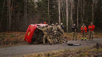 Alaska Air National Guardsmen assigned to the 212th Rescue Squadron, 176th Wing, flip a vehicle while conducting a full mission profile exercise at Joint Base Elmendorf-Richardson, Alaska, Oct. 13, 2021. The busiest rescue force in the Department of Defense, the 212th RQS provides elite pararescuemen and combat rescue officers that are uniquely skilled in integrating air and ground capabilities to carry out the 176th Wing’s wartime and peacetime personnel recovery missions. (U.S. Army National Guard photo by Dana Rosso)