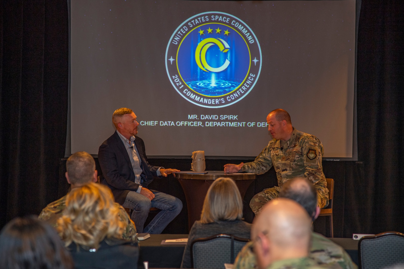 U.S. Air Force Col. James Peterson (right), USSPACECOM Commander’s Action Group chief, led a fireside chat with David Spirk (left), the U.S. Department of Defense’s chief data officer, at the 2021 Fall Commander’s Conference, Oct. 26, 2021, at Peterson Space Force Base, Colorado. Spirk discussed strengthening data management across the military and accelerating the transition to a data-centric culture.